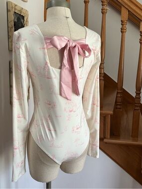 Francesca's Ivory Swan Print Long Sleeve Bodysuit with Back Tie Bow